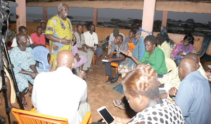 Nana Kofi Bentsil (standing), chief fisherman at the Axim landing beach, interacting with the media. Pictures: GABRIEL AHIABOR 
