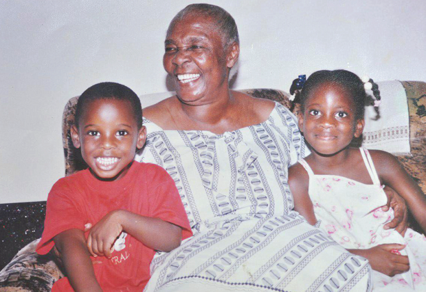 The late Madam Evelyn Charity Nornoo flanked by some of her grandchildren.
