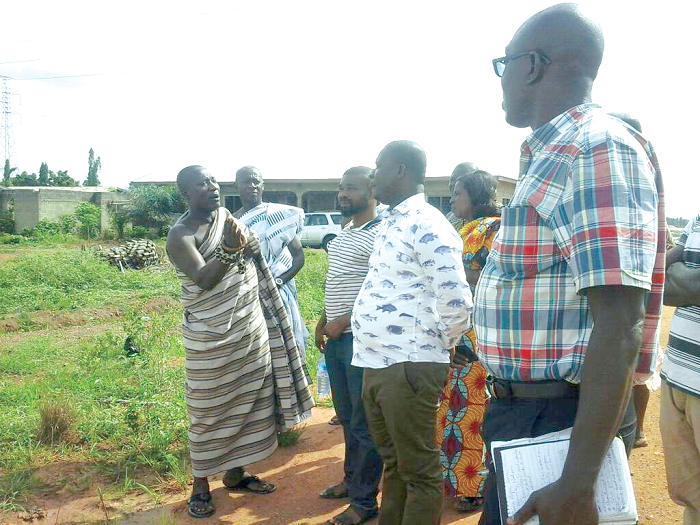 • Mr Michael Awuku Amoah (2nd right) exchanging pleasantries with the Wansamirehene, Nana Kwame Frimpong (left), during his visit to Wansamire, near Asuofua, in the Atwima Nwabiagya District in the Ashanti Region