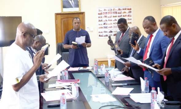Members of the board swearing the Oath of Office