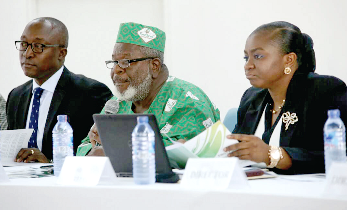 Prof. Cletus Dordunoo (middle) speaking at the AGM in Accra. With him are Mr Amenyo Setordzie, Managing Director, FirstBanC Financial Services, and Ms Brenda Semevo Afari, Company Secretary. Picture: Samuel Tei Adano