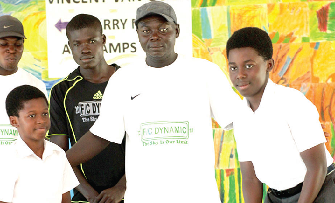 Kwabena (right) and Ekow (left) in a pose with Mr Joseph Oppong and another representative of one of the clubs