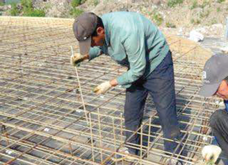 The fibre glass re-enforced polymer bar being fixed at a construction site in Accra
