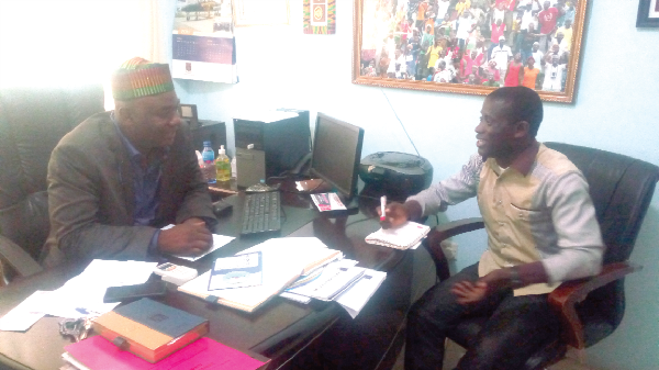 Dr Bitugu (Left) in a chat with, Kwame Larweh of Graphic Sports