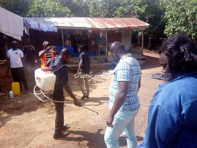 Health officials spraying insecticides in the Juboso district in the Western Region