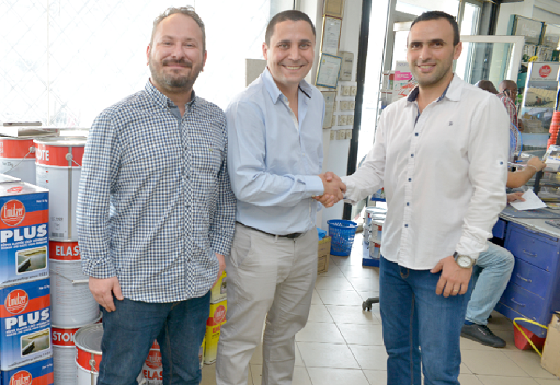 Mr Ziad Khoury (right), General Manager of City Paints, in a handshake with Mr Cagkan Goymat, Export Manager of Emulzer. With them is Mr Can Sahan, Sales Executive, Emulzer