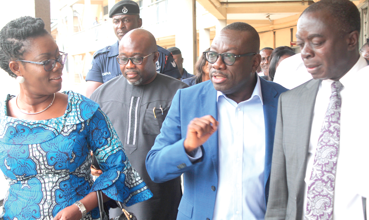 Mr James Kwofie (2nd right), explaining a point to Mrs Ursula Owusu-Ekuful (left), Mr George Andah (2nd left),Deputy Minister of Communication and Mr Kwasi Agyei Tabi (right), Director of Finance and Administration, Ministry of Communications after the ceremony