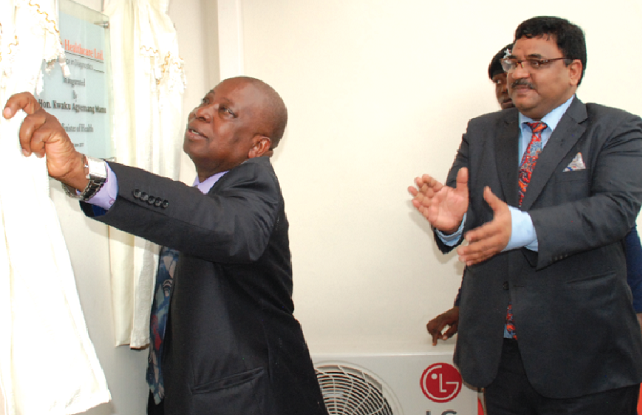 Mr Kwaku Agyemang-Manu (in front) unveiling a plaque to officially open the Sunshine Healthcare Limited. Applauding is Mr Birender Singh, Indian High Commissioner  in Accra