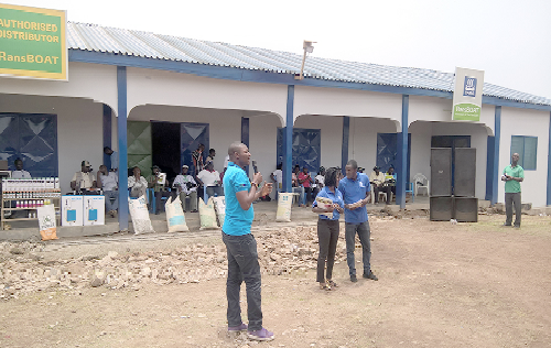 Mr Osman Issaka Yara (left) explaining how farmers can derive maximum benefits from Yara products