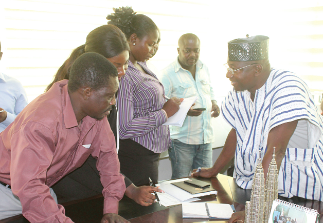 Mr Cheyuo Wienaa Musah, Director, Driver Training, Testing and Licensing, DVLA, explaining a point to some journalists at the news conference