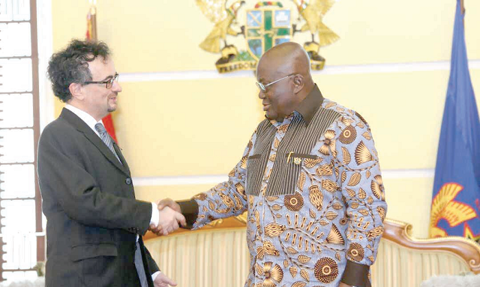 President Akufo-Addo in a hand-shake with Mr Jon Benjamin (left), outgoing British High Commissioner in Accra at the Flagstaff House.  Picture: Samuel Tei Adano