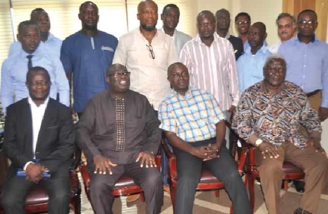Mr Osei Assibey-Antwi (seated 2nd right) with some executive members of the Advertisers Association of Ghana (AAG)