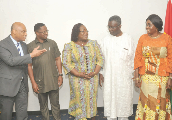 Mr Jean-Claude Brou (left), Minister of Industry and Mines of Cote d'Ivoire, interacting with his Ghanaian conterparts. Among them are Mr John Peter Amewu (2nd left), Prof. Kwabena Frimpong Boateng and Mrs Barbara Oteng Gyasi (right)