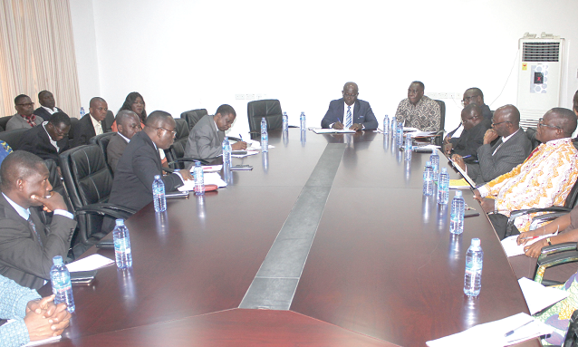 Mr Eugene Ofoshene (at the head of table) addressing some staff of the CAGD