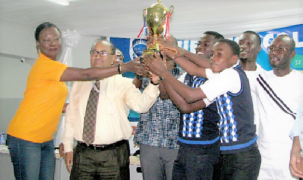 Ernest Kwanteng (2nd right) and Ernest Agyemang (right), the two awardees of Labone Senior High, holding the cup together with Dr S.K. Roy (2nd left), Rector of  Blue Crest College, and some officials. Picture: ESTHER ADJEI