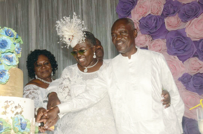 Gifty is joined by her husband Mr K.T. Dadzie and a friend to cut the birthday cake.