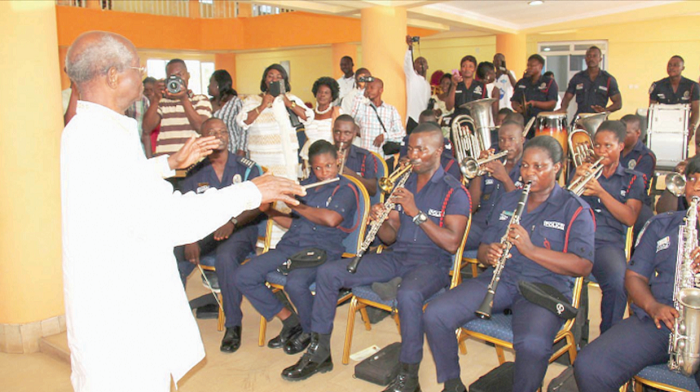 • Prof Nketia conducting the Ghana Police Band at a ceremony in Accra last year