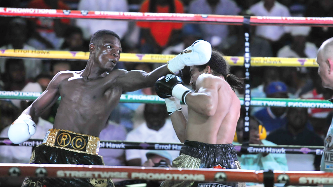 Belgian Hedi Slimani dodges a Richard Commey left punch during their WBC International Gold lightweight bout. Picture by EMMANUEL QUAYE 