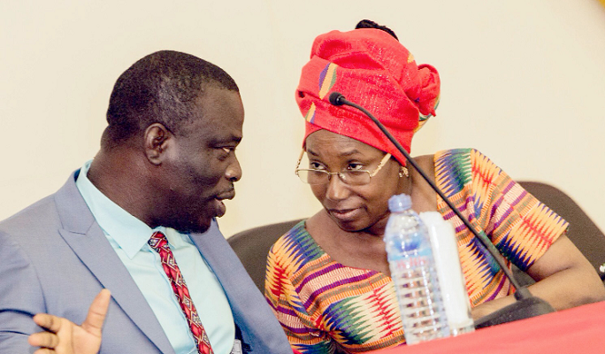   Mr Awuah interacting with Rev. Dr Ocansey at the launch