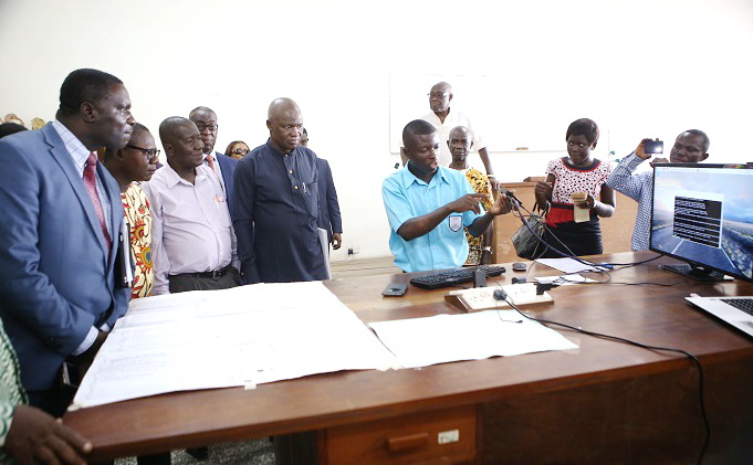 Master Emmanuel Osei Ababio of St Thomas Aquinas demonstrating how the HexEduBox  works while Dr Yaw Osei Adu-Twum, MP for Bosumtwi, Director-General of the Ghana Education, Mr Jacob Kor, and other guests look on. Inset: The winners and guests at the awards ceremony 