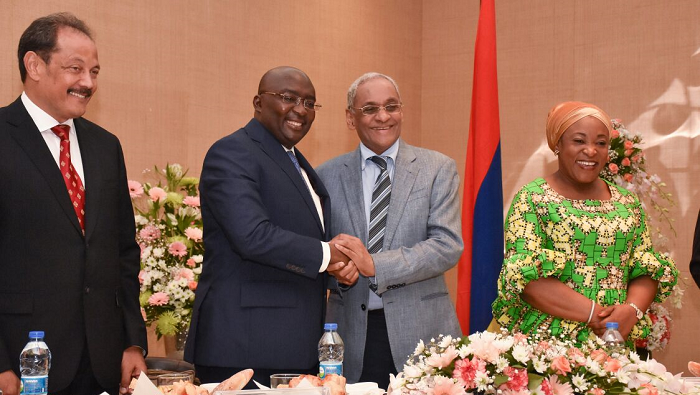  Dr Mahamudu Bawumia in a handshake with Mr Lutchmeenaraidoo after a breakfast meeting. Those with them are Ms Shirley Ayorkor Botchwey (right), the Foreign Minister, and Mr Gerard Sanspeur, Chairman, Board of Investment 