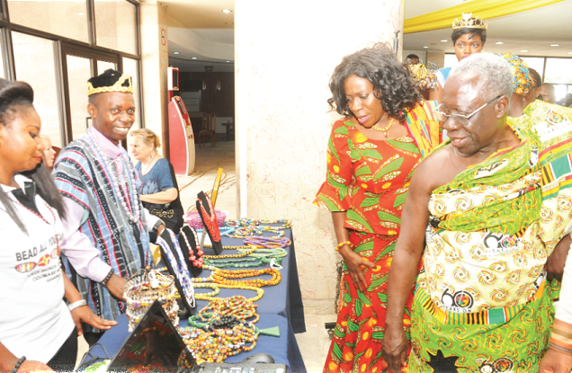 Senior Minister, Mr Yaw Osafo-Maafo and Mrs Catherine Afeku, Minister for Tourism, Arts and Culture admiring some beads on exhibition