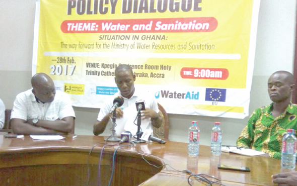  Mr Benjamin Lartey (middle), a spokesperson for CONIWAS, flanked by some members of the coalition during the press conference 