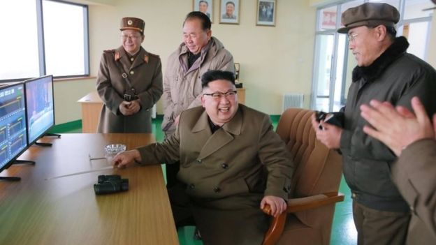 Pictures released by North Korea's state news agency show Kim Jong-un at the engine test