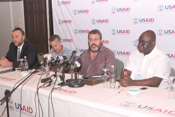 Mr Andy Karas (3rd left) explaining a point during the press briefing. Those with him are Mr Kwesi Korboe (right), Mr Kevin Sharp (left), and Mr Brian Conklin (2nd left), both representatives of USAID.