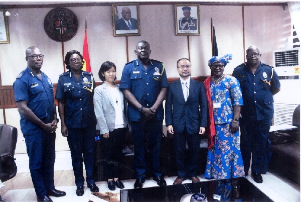 Mr David Asante-Apeatu (middle), Mr Koji Makino (3rd right) and other senior officials of the Police Service and JICA after the courtesy call
