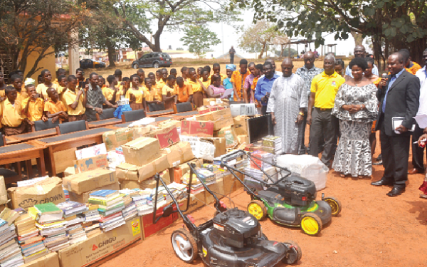 Mr Alfred Kwame Ofori (in suit), the donor, Mrs Cynthia Osei-Poku, the head teacher (second right), dignitaries and some of the pupils 