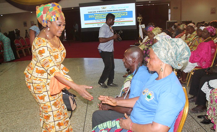 Ms Otiko Afisah Djaba (left), exchanging pleasantries with some beneficiaries of the WB/JSDF Rural Income Generation Pilot Project before the dialogue. Picture: EDNA ADU-SERWAA