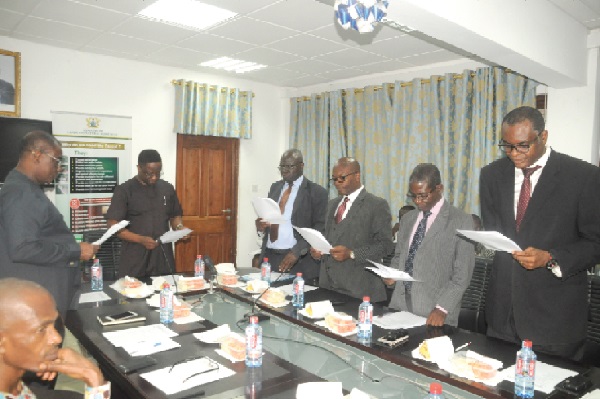 Mr John Peter Amewu (2nd left), Minister of Lands and Natural Resources, and some members of the newly constituted audit committee of the ministry taking their oath at the inaugural ceremony in Accra. Picture: GABRIEL AHIABOR