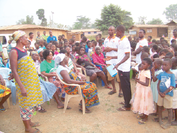  Organisers of the programme interacting with some market women and pupils in some beneficiary communities visited by the team