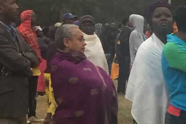 First Lady Margaret Kenyatta standing in a queue at Nairobi’s St Mary School polling centre in Lavington, Nairobi. 