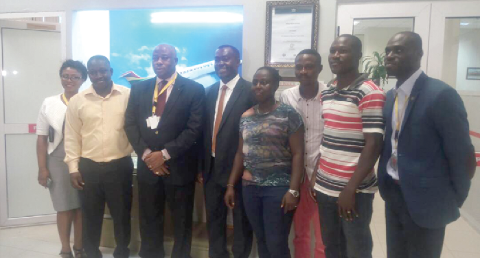 Mr Samuel Thompson (left), with Mr Afadzinu (3rd left) and some players of the national team