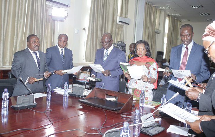 Mrs Abena Osei Asare (4th left), a Deputy Minister of Finance, Mr Eugene Ofosuhene (3rd left), Controller and Accountant General, Mr Partrick Nomo (right), Chief Director of the Ministry of Finance, and another official  swearing an oath at the Public Accounts Committee sitting in Accra