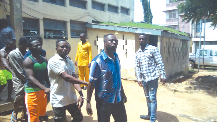 Some of the accused on their way out of the court room