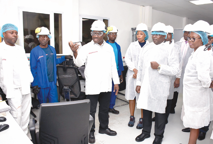 An official of Barry Callebaut briefing Vice-President Dr Mahamudu Bawumia (2nd right) on the operations of the company