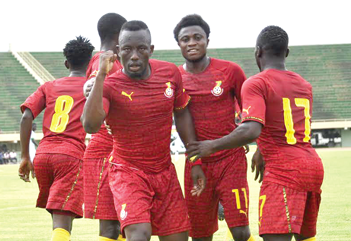 Sadick Adams joins teammates to celebrate after Gideon Waja (back to camera) restored Stars’ lead