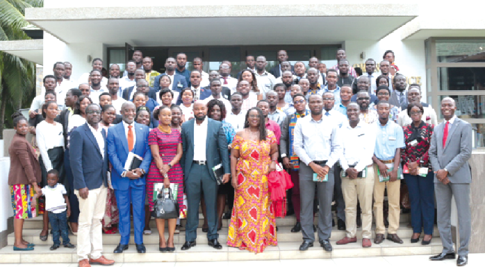 Mr Yofi Grant (second left) in a group photograph with participants after the forum