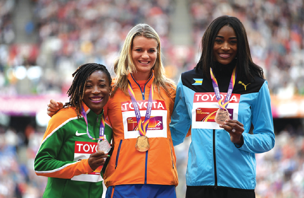 Cote d’Ivoire’s Marie-Josee Ta Lou displays her silver medal won in the 200m women’s  final, as  she shares the podium with champion and gold medalist, Dafne Schippers of The Netherlands, and bronze medalist, Shaunae Miller-Uibo of The Bahamas