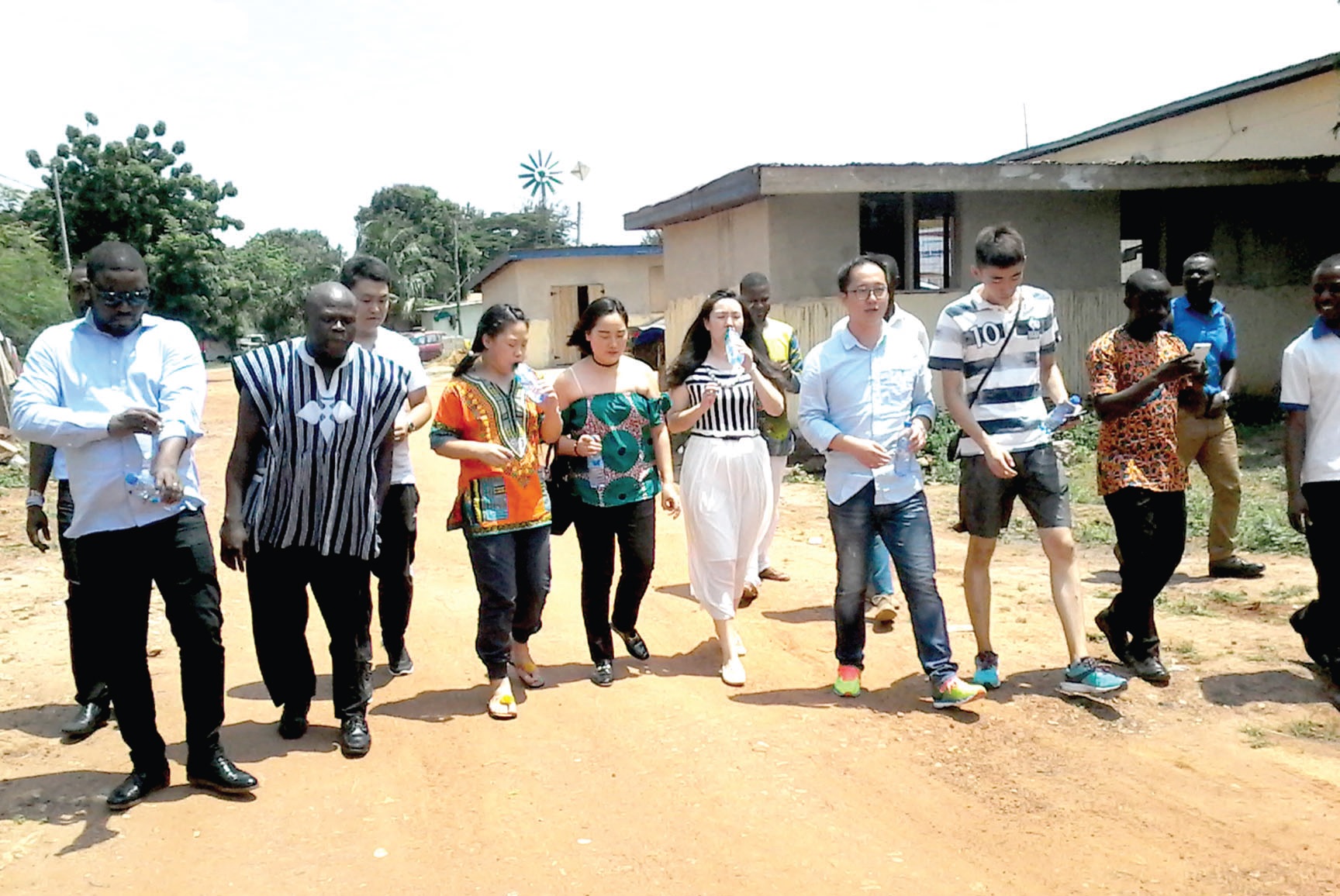  Ing. Emmanuel Ashie (second left), Manager of the Construction Machinery Mechanics Training Institute (CMMTI) taking members of the Chinese delegation on a tour of the institute’s land