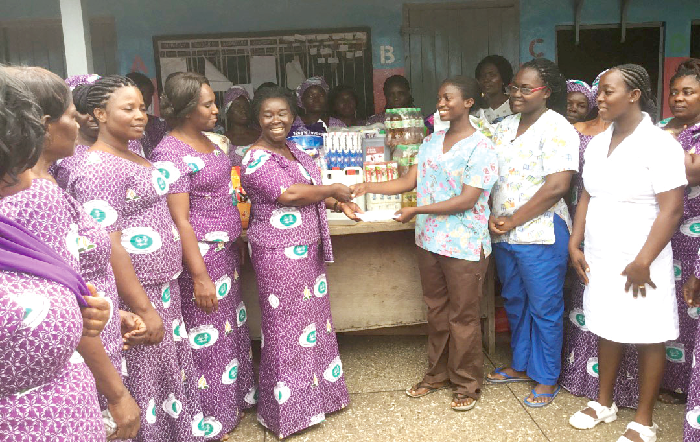 Mrs Attakora (left) presenting the items to Ms Makafui