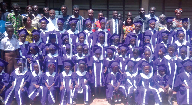 A group photograph of the KG and primary pupil who graduated to the next level with their leaders