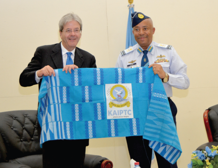 Air Vice-Marshal Griffiths Evans (right), Commandant of the KAIPTC, presenting a gift to the Italian Prime Minister 