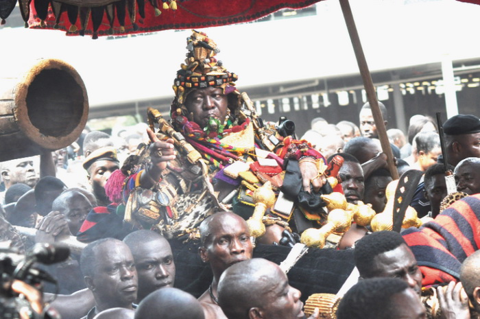 Asantehene, Otumfuo Osei Tutu II, riding in a palanquin