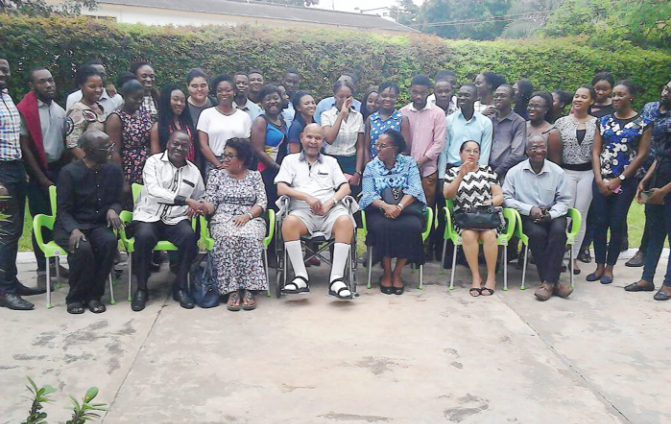 Dr Evans-Anfom  (middle) with management members and students of the Family Health University College Medical School
