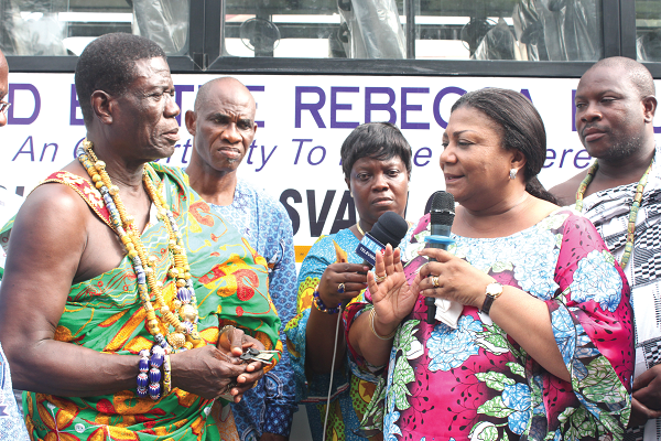 Mrs Rebbeca Akufo-Addo (3rd right), the First Lady of Ghana, with Nene Kanor Atiapa III (2nd right), the acting paramount chief of Ningo, and other elders of Ningo during the presentation of the bus