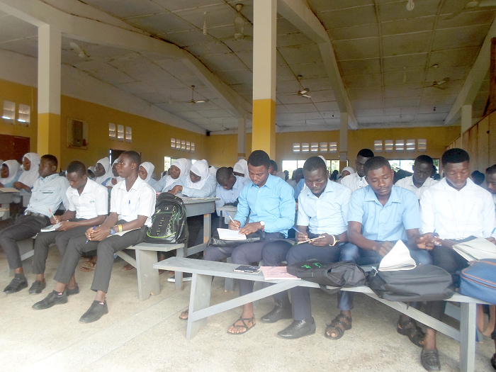 Some students of the college having classes in the mosque